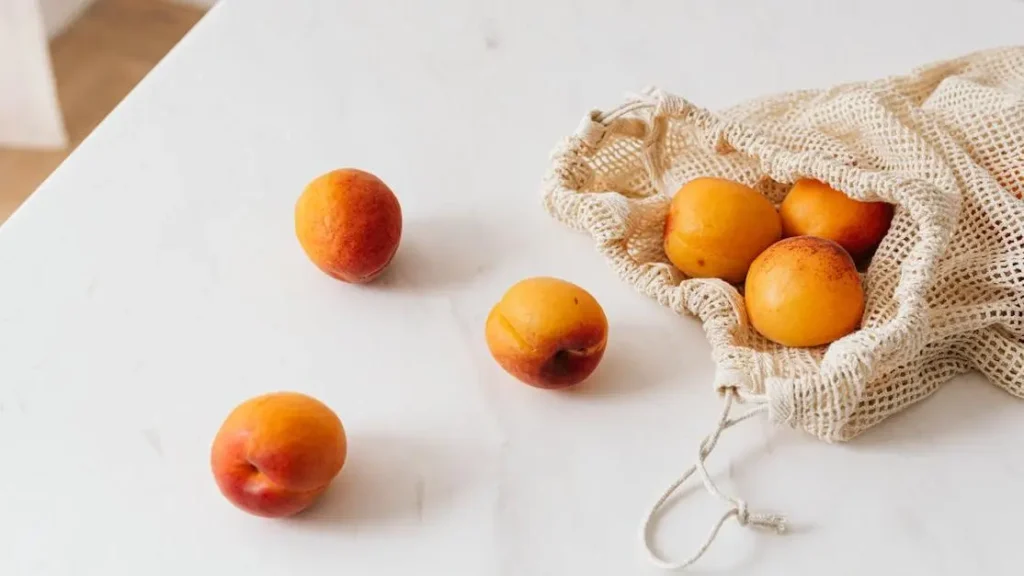 Organic apricots in cotton sack, a food that helps with vaginal dryness