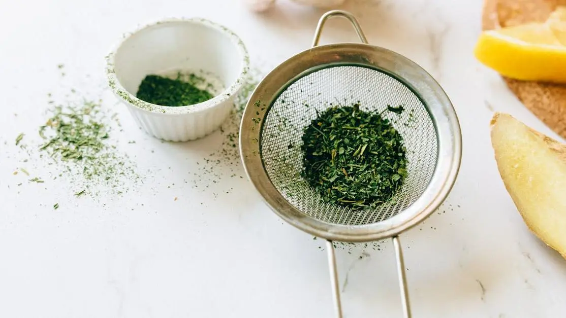 Herbs in a strainer for a home remedy to cure yeast infection