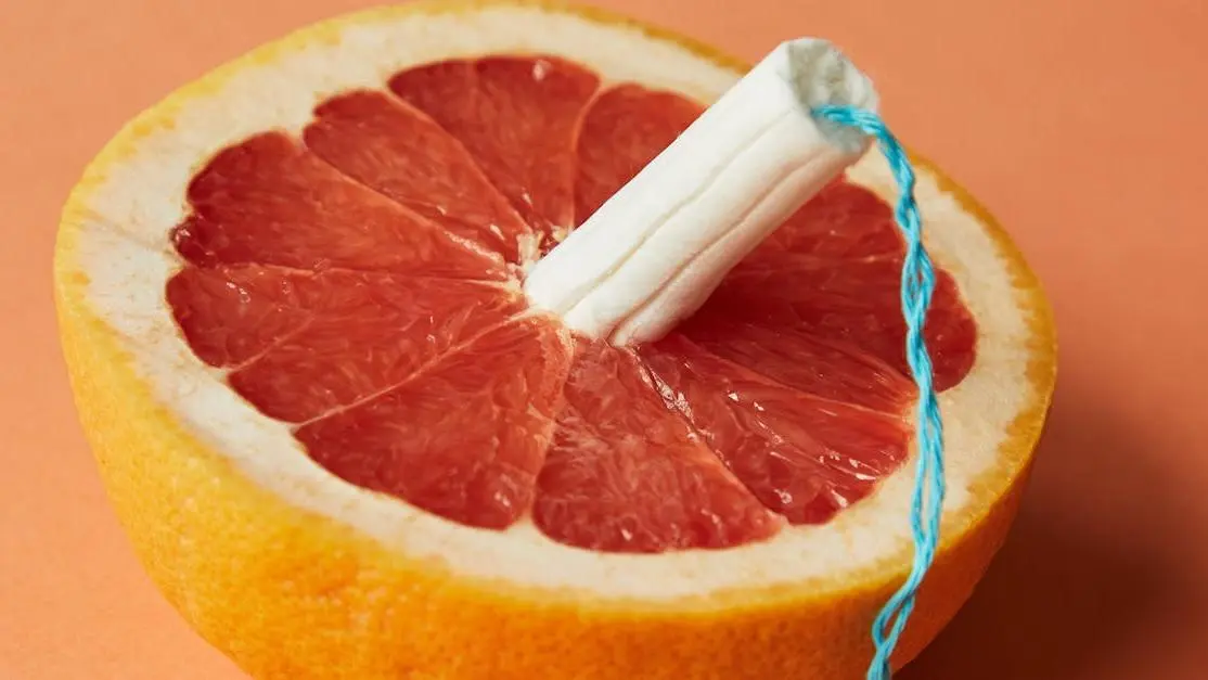 Grapefruit half with tampon illustrating Bacterial Vaginosis and Period.