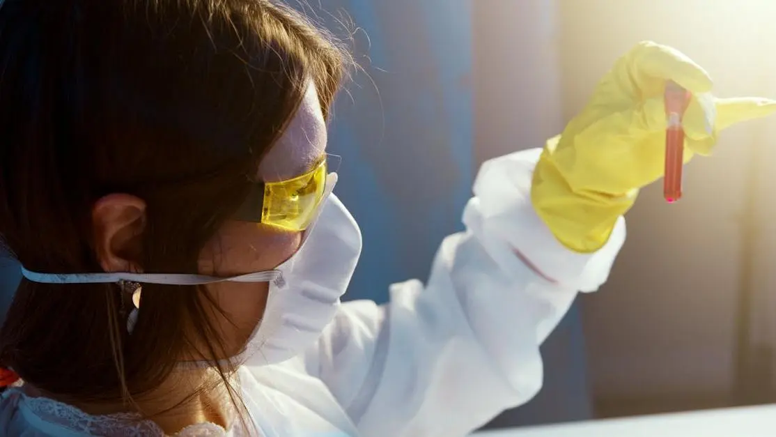 Woman examining blood sample for Candida and Yeast Infections