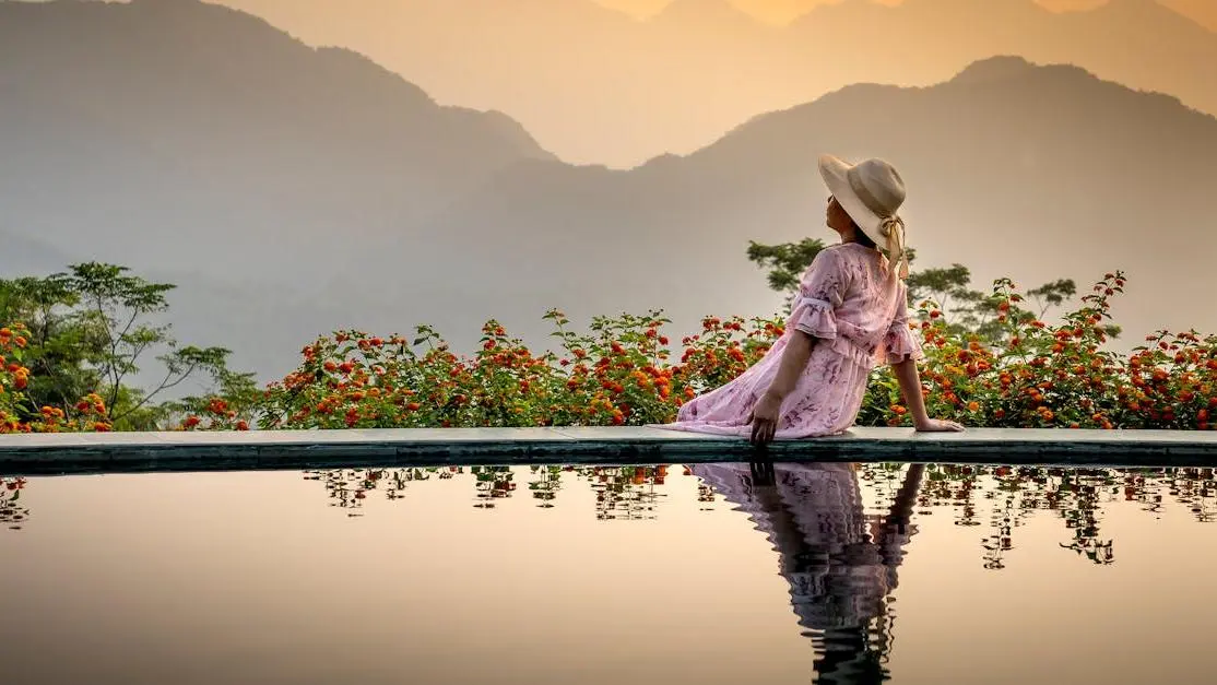 Woman relaxing poolside, considering Chasteberry for hot flashes.