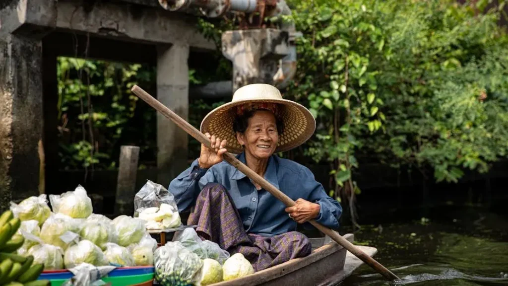 Woman holding vegetables and fruit in a boat, illustrating Diet and Yeast Infections.