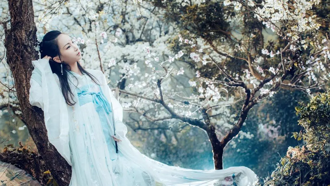 Woman in dress among cherry blossom trees addressing feminine odor after menopause