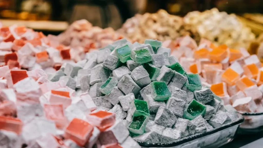 Sugar cubes and powdered sugar representing the link between high sugar diets and yeast infections