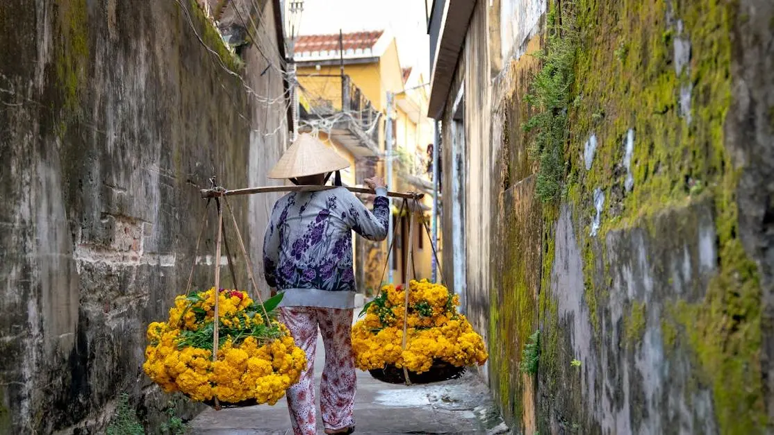 Woman carrying flowers in conical hat, symbolizing hormonal imbalance and yeast infections.