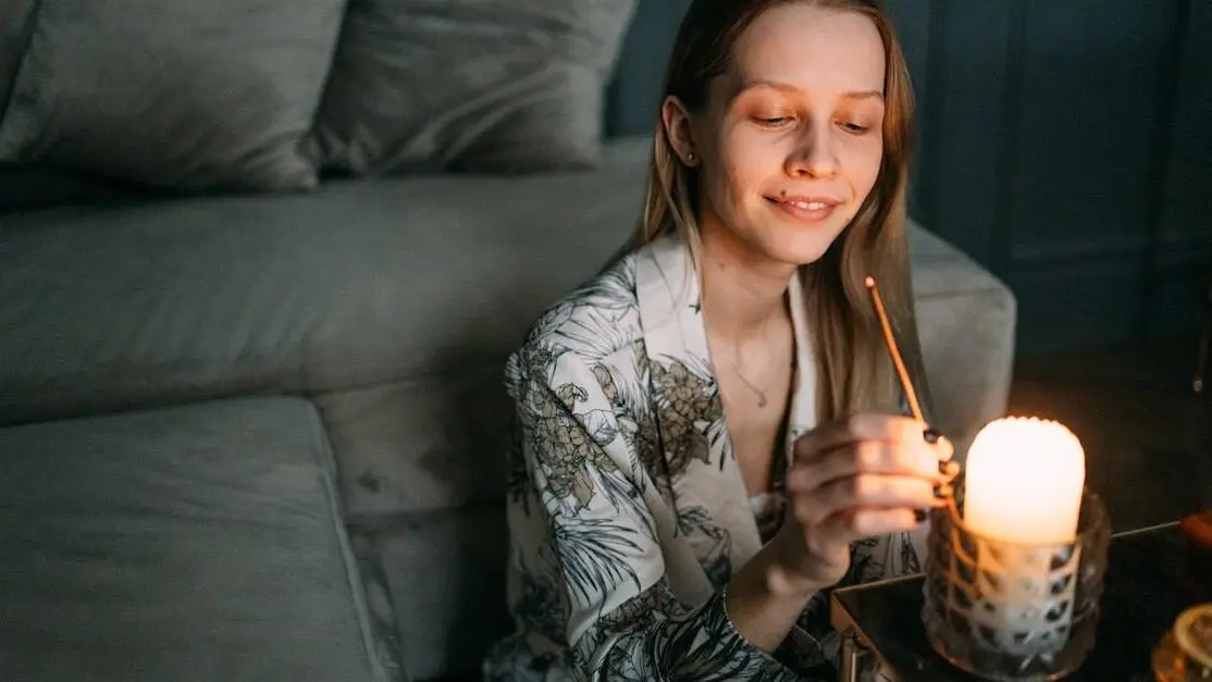 Woman sipping tea, contemplating Hormone Replacement Therapy (HRT) For Peri Menopause.