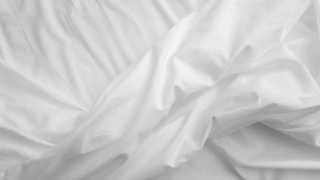 Night sweats drenching bed sheet.