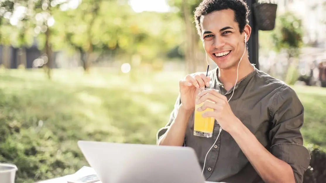 Cheerful man implementing lifestyle changes to prevent recurring BV while relaxing in park.