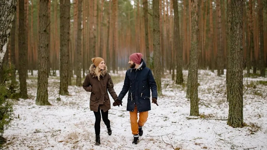 Couple walking in forest discussing menopause and relationships