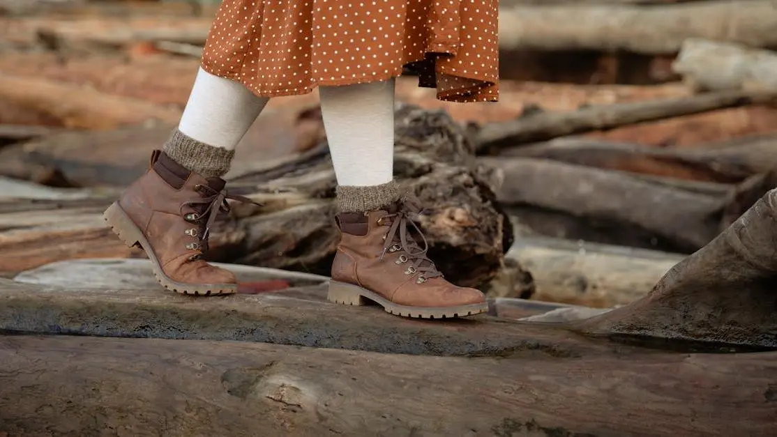 Woman walking on log in autumn countryside for Menopause Glossary article