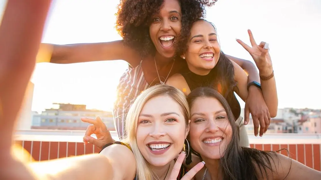 Cheerful diverse women taking a selfie, debunking "Myth: Menopause is the Same for Every Woman"