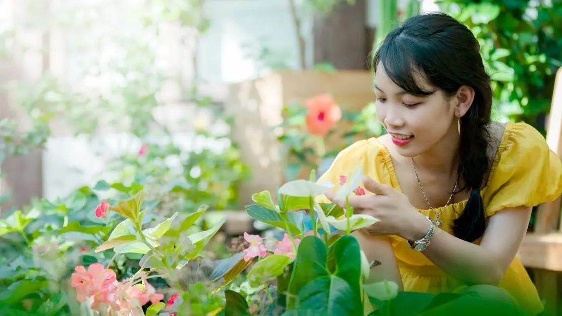 Woman Holding Flower: Myth: You Can't Get Pregnant During Menopause