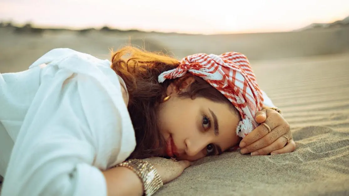 Woman relaxing on the beach, showcasing Non-Hormonal Treatments for Hot Flashes