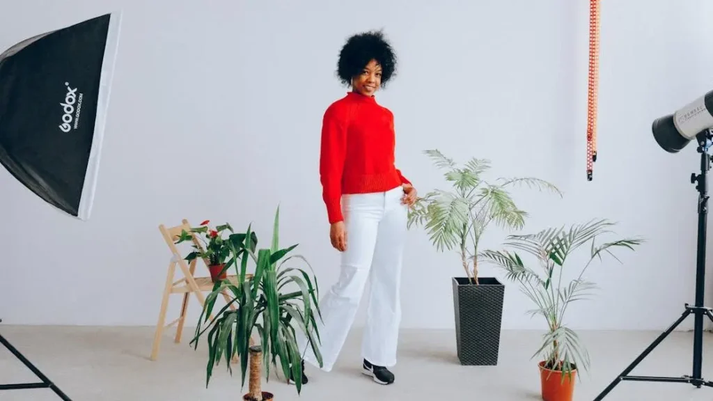 Smiling ethnic woman amidst plants, debunking Peri Menopause Myths