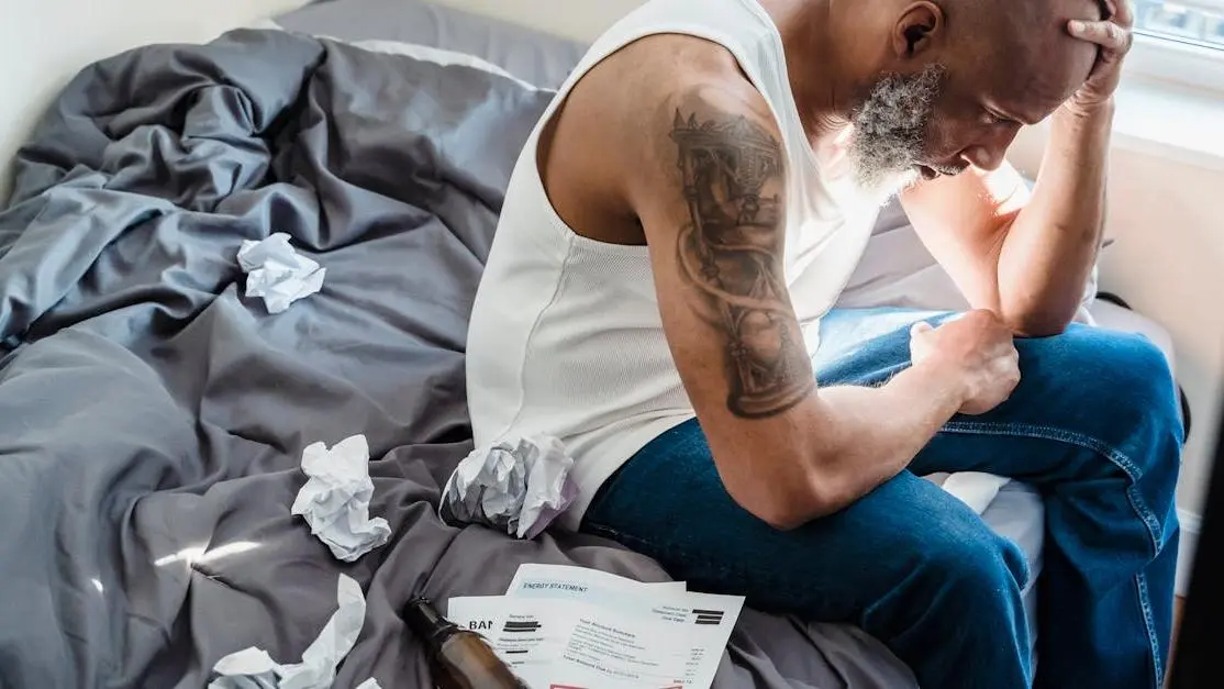 Stressed man on bed related to yeast infections