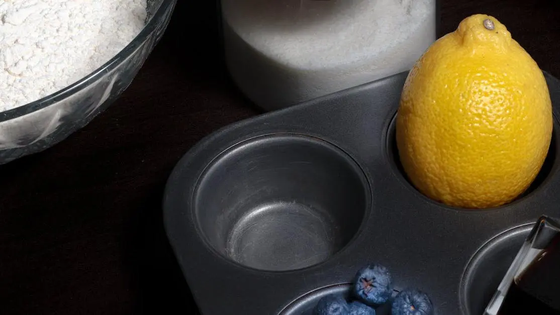 Blueberries, lemon, and sugar on a tray representing ingredients affecting hot flashes