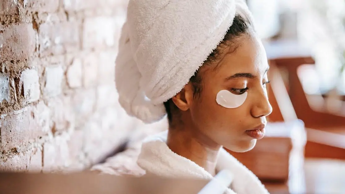 Young woman in robe and towel resting in beauty salon, relating to Transdermal Hormones Hot Flashes