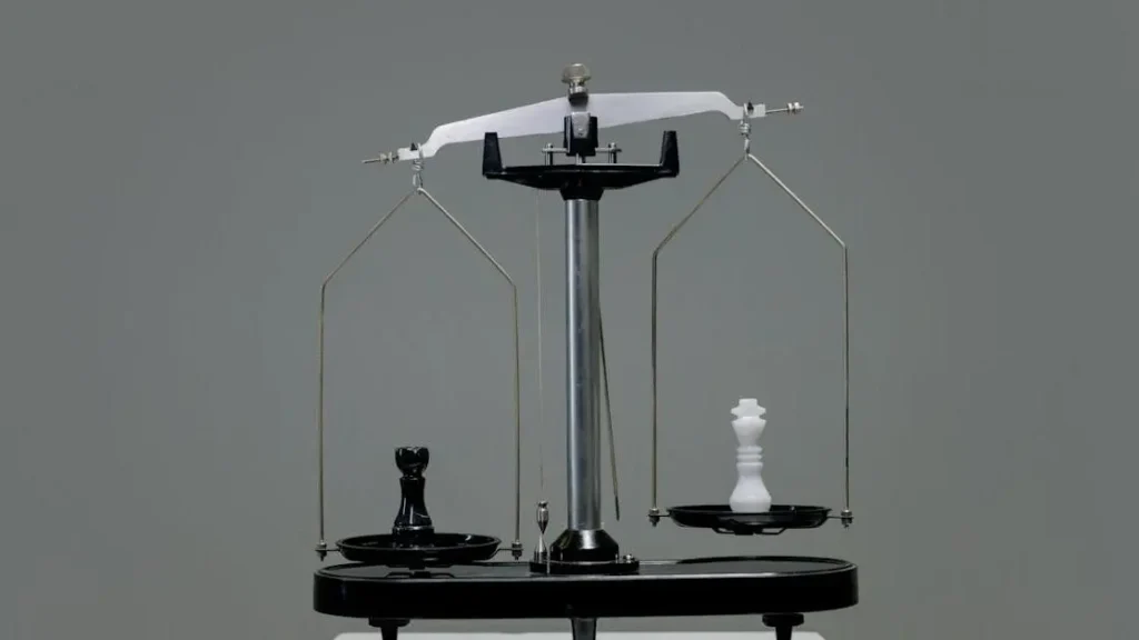 GLP-1 weight loss medications side effects represented by balanced chess pieces on a scale.